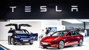 Tesla automobiles in showroom - certain agencies rate fossil-fuel giant Exxon Mobil and EV maker Tesla the same for ESG