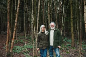 Founders Rose and Chris Bax, pictured in woodland setting