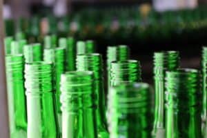 Close-up image of green glass bottles