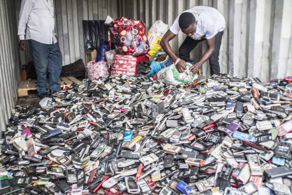 Floor covered in sea of waste mobile and cell phones