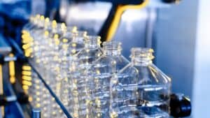Row of plastic bottles on a factory production line