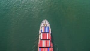 Aerial view of container shipping by sea.