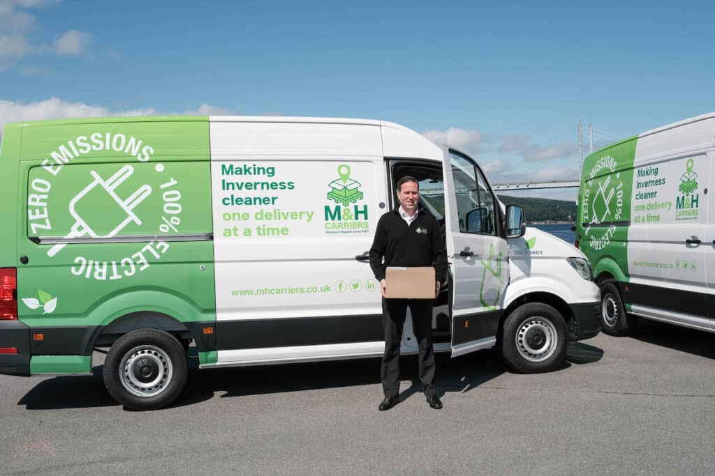 Fraser MacLean, managing director of M&H Carriers, with the new Highland electric delivery fleet